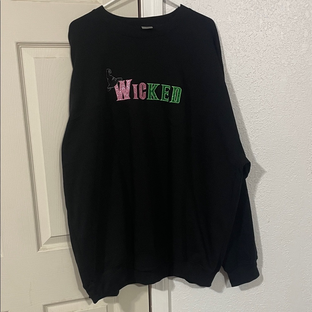 Wicked Black Sweater embroidered with a witch’s hat